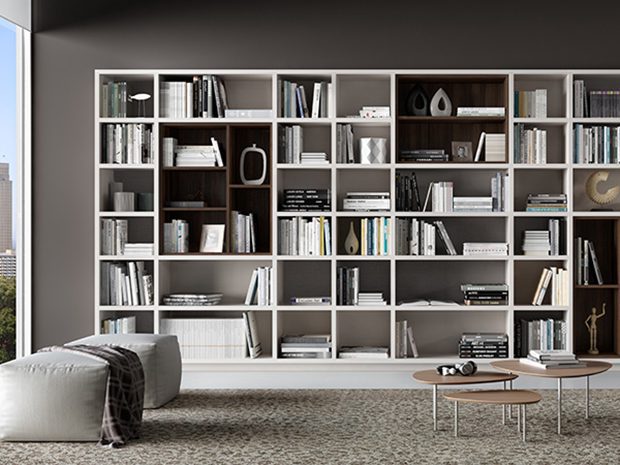 Modern bookshelves in a reading room designed in white wood grain finish by California Closets