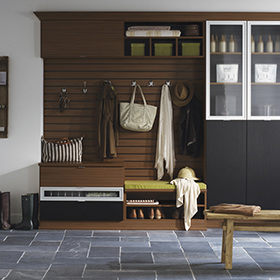 Dark Brown and Black Entrance Way Storage with Cubbies Cabinets Coat Hangers Display Shelves with Glass Doors and White Trim