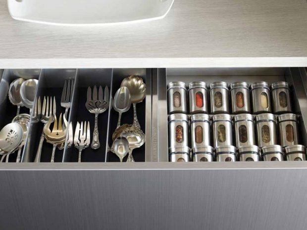 Grey finish kitchen drawer with pullout spice rack storage by California Closets