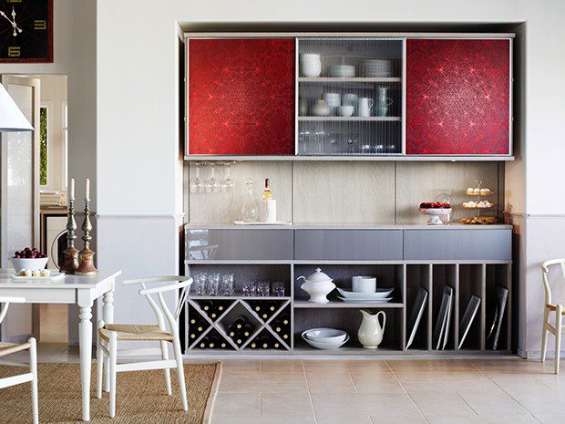 Kitchen pantry cabinets in grey wood grain finishes with ecoresin red sliding doors, wine storage and custom drawers by California Closets