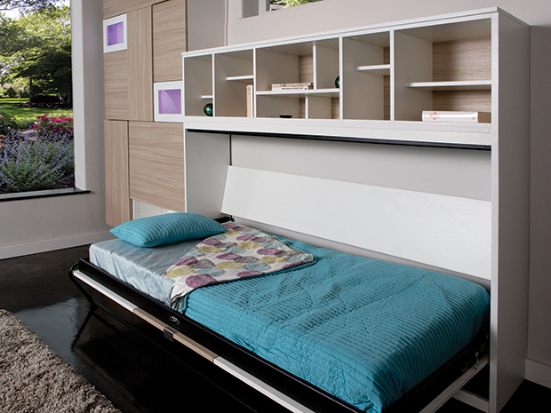 Horizontal murphy bed opened under cabinets and open shelves created by California Closets