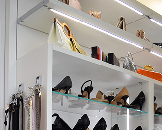 California Closets top 10 designs shoe shelving in white finish with glass shelves
