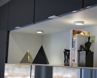 Alisha Close up detail image of accent lighting in white recessed cabinet space
