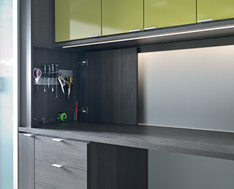 Close up of Garage storage solution in dark brown wood grain finish with lime green front paneling
