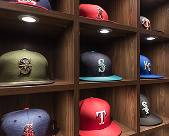 Close up of MLB hat storage in lighted cubby closet system