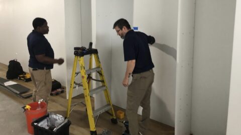 Two California Closets employee creating a custom closet